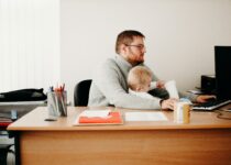 working parents with baby in the office