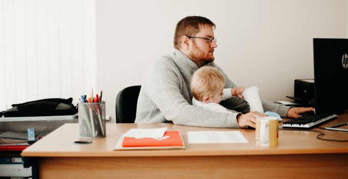 working parents with baby in the office